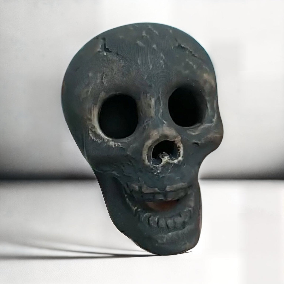 Ceramic Skull Fire Pit Log with Hollow Eye Openings for Halloween Displays