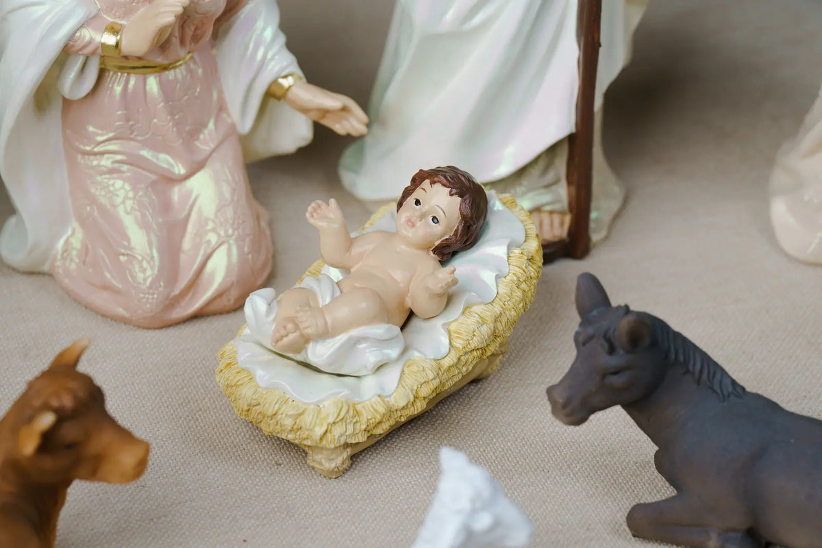 Eleven Piece Blush Pink and Ivory Nativity Set with a Gloria Banner Angel and a Pearlized Finish in Three Sizes